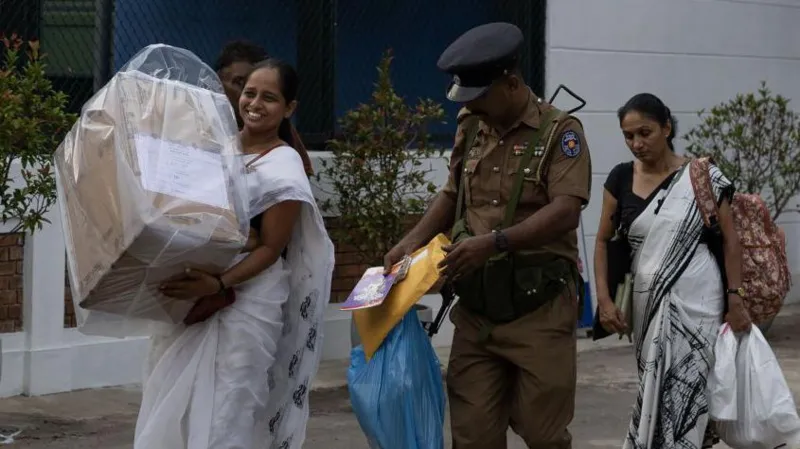 a woman carrying a bag of goods